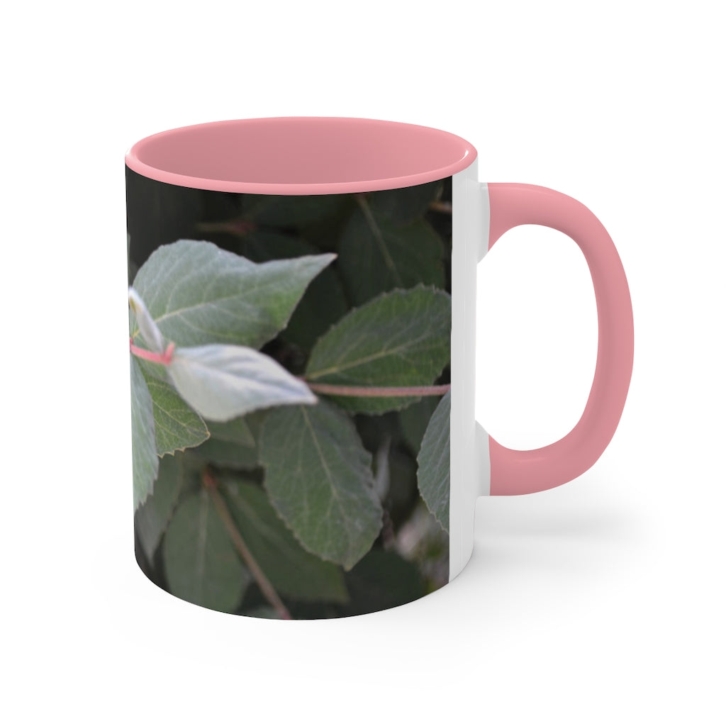 A stylish Green Leaves Accent Mug featuring a white exterior with a colored interior, showcasing a beautiful green leaves design.