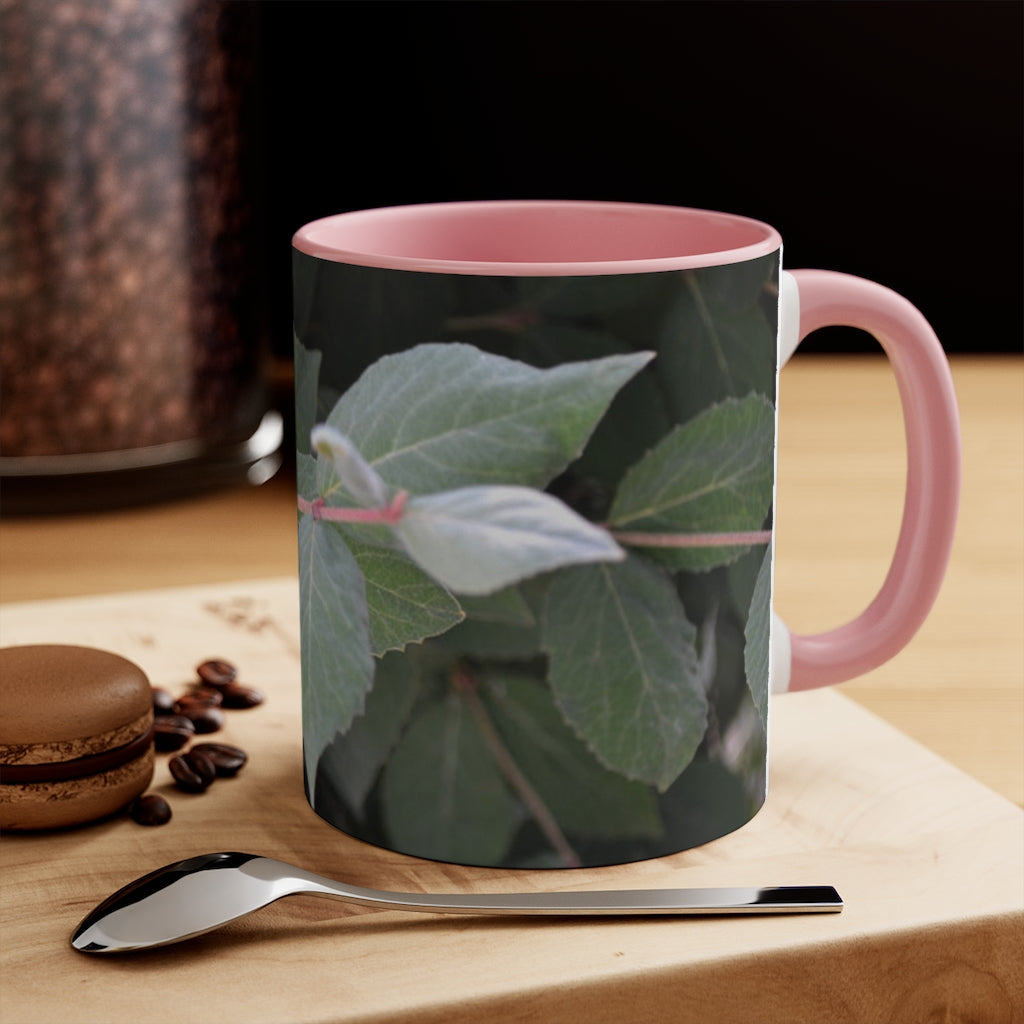 A stylish Green Leaves Accent Mug featuring a white exterior with a colored interior, showcasing a beautiful green leaves design.