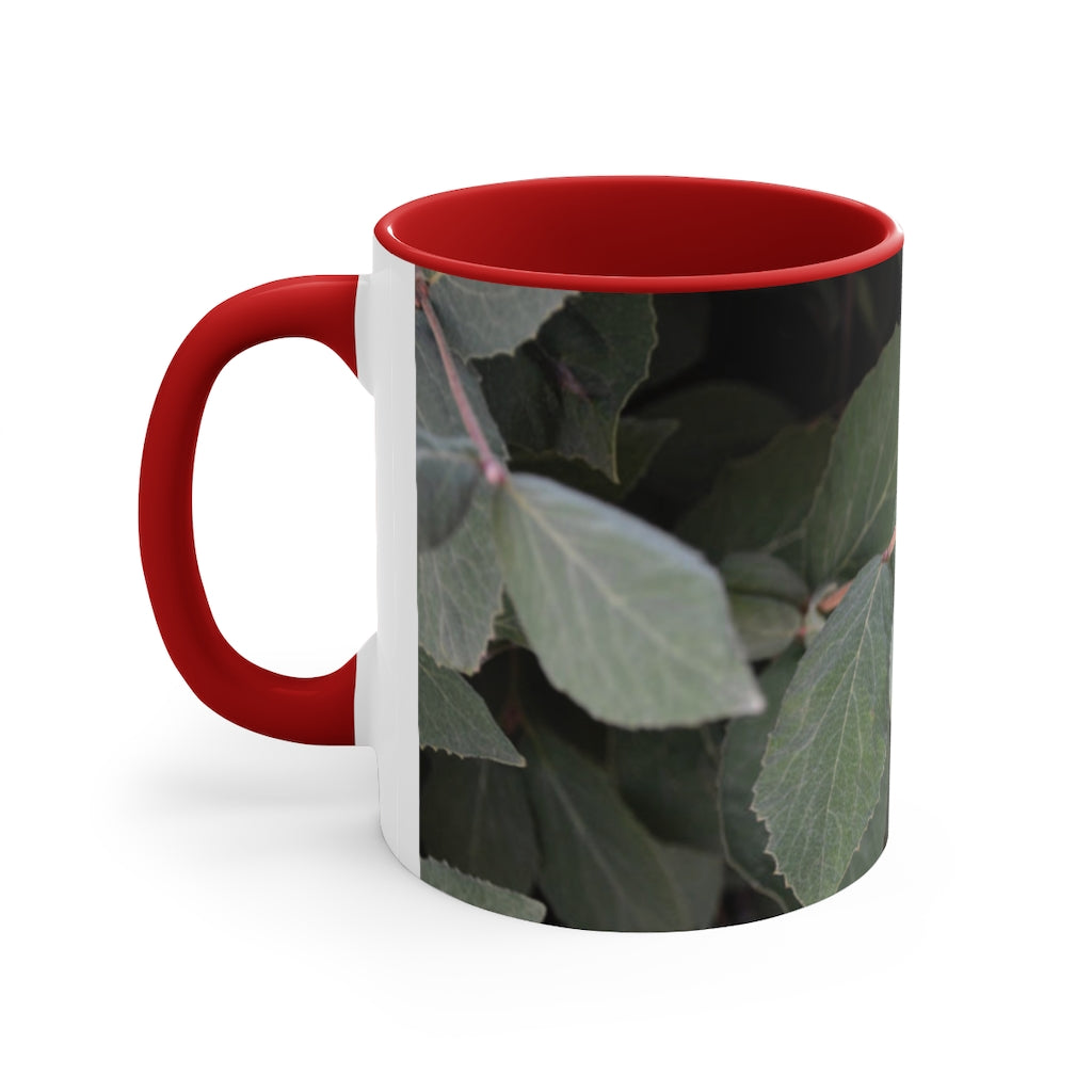 A stylish Green Leaves Accent Mug featuring a white exterior with a colored interior, showcasing a beautiful green leaves design.