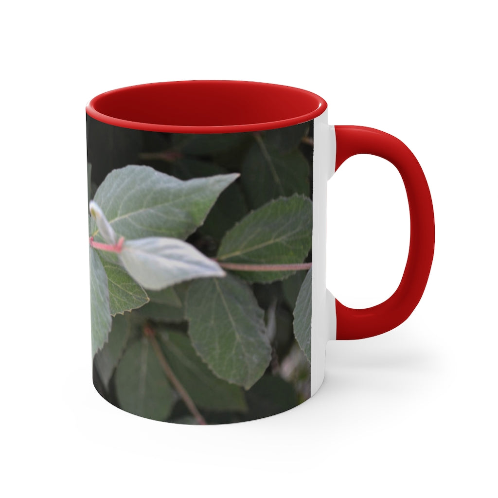 A stylish Green Leaves Accent Mug featuring a white exterior with a colored interior, showcasing a beautiful green leaves design.