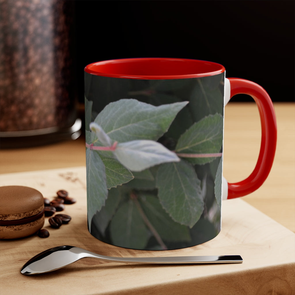 A stylish Green Leaves Accent Mug featuring a white exterior with a colored interior, showcasing a beautiful green leaves design.