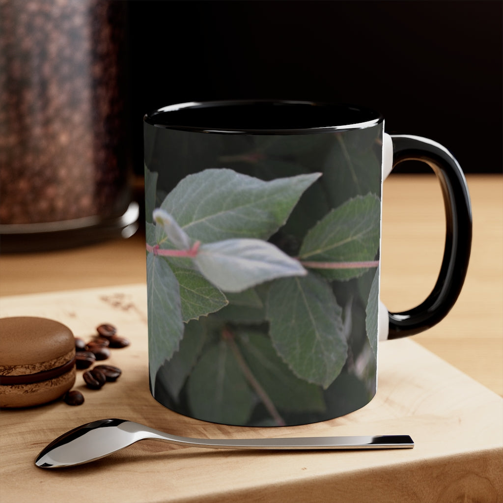 A stylish Green Leaves Accent Mug featuring a white exterior with a colored interior, showcasing a beautiful green leaves design.