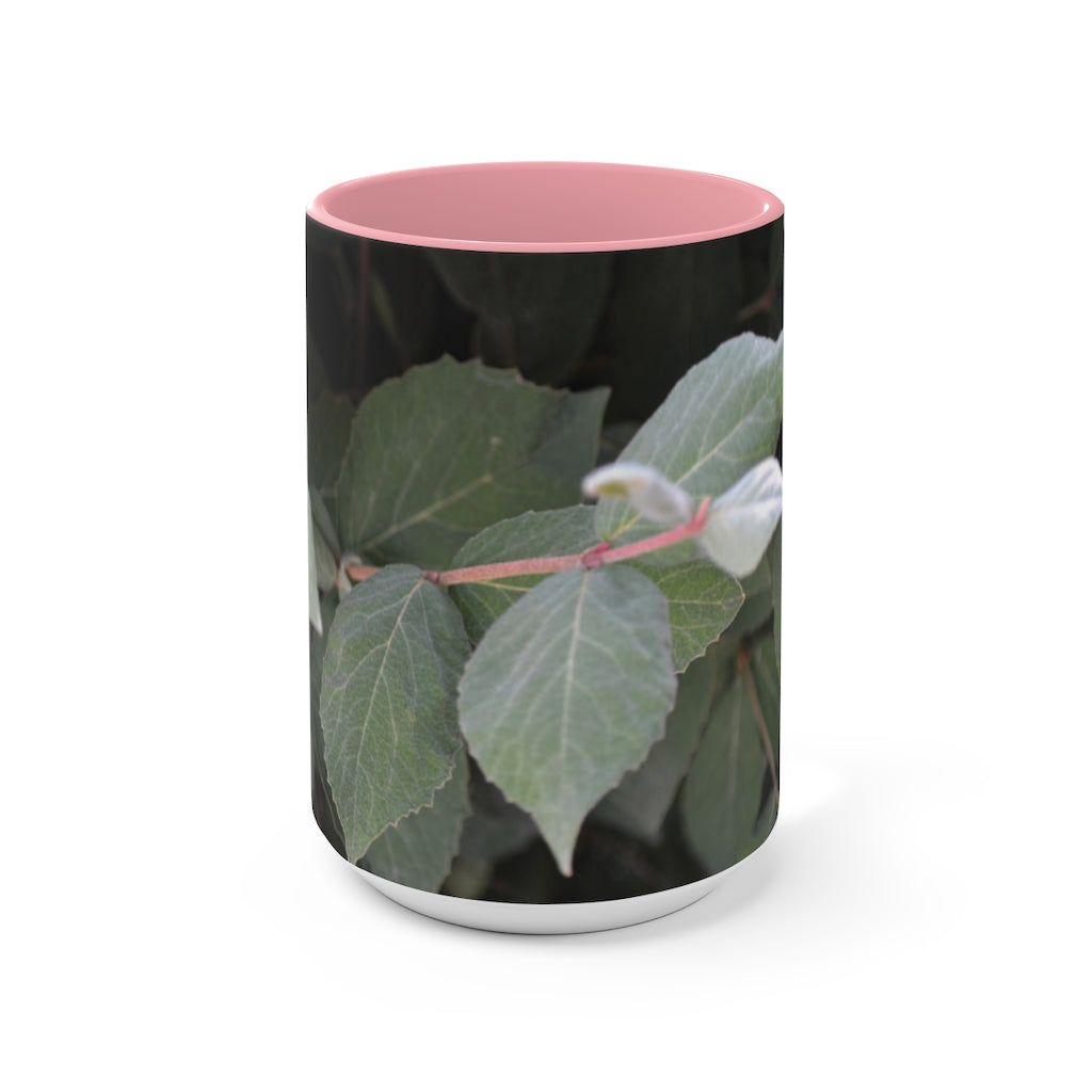 A stylish Green Leaves Accent Mug featuring a white exterior with a colored interior, showcasing a beautiful green leaves design.