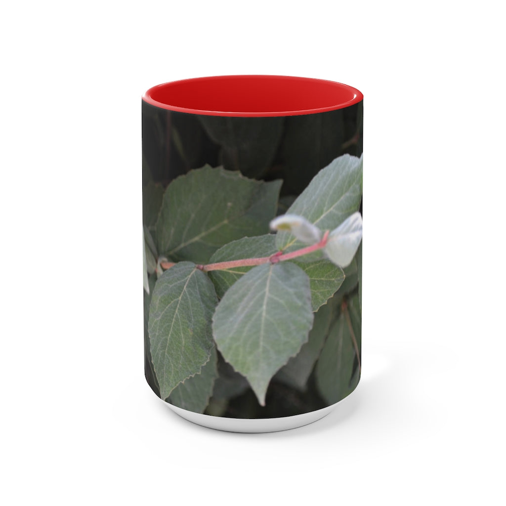 A stylish Green Leaves Accent Mug featuring a white exterior with a colored interior, showcasing a beautiful green leaves design.