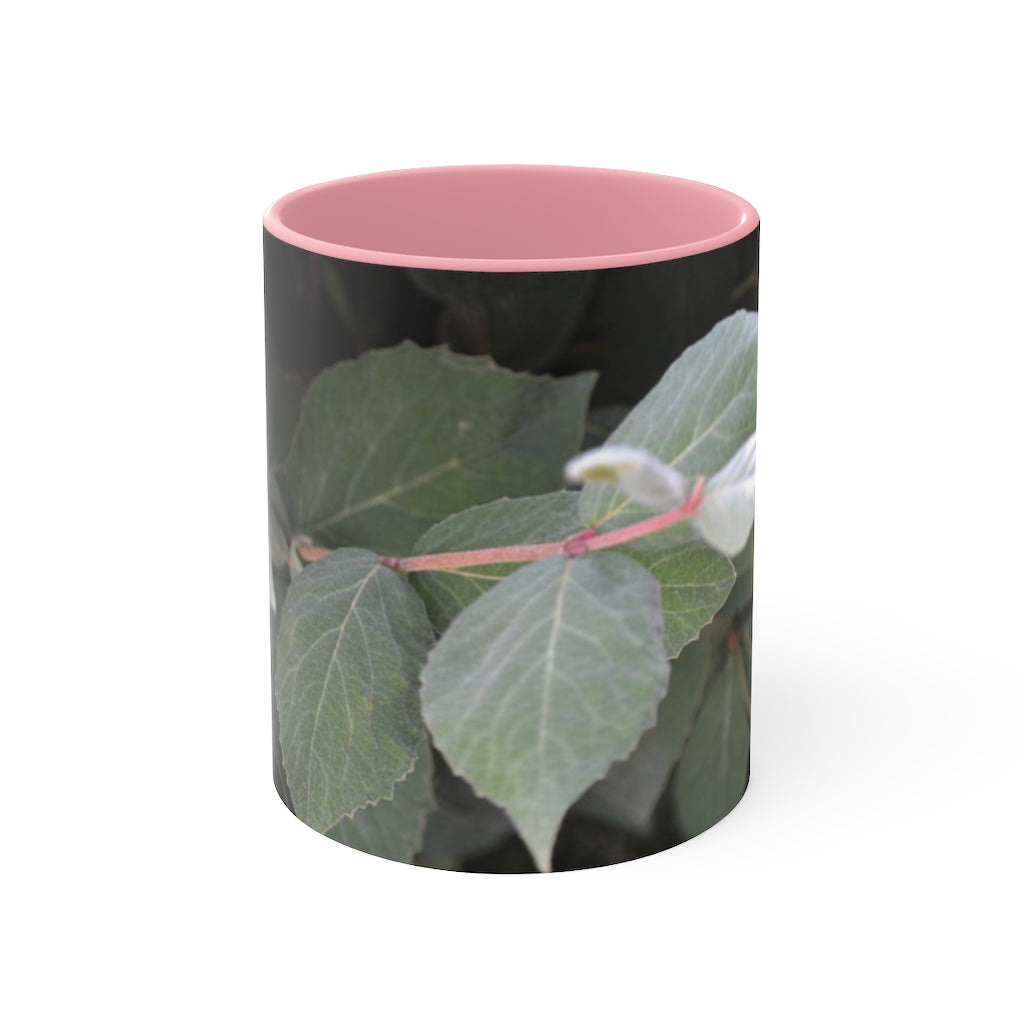 A stylish Green Leaves Accent Mug featuring a white exterior with a colored interior, showcasing a beautiful green leaves design.