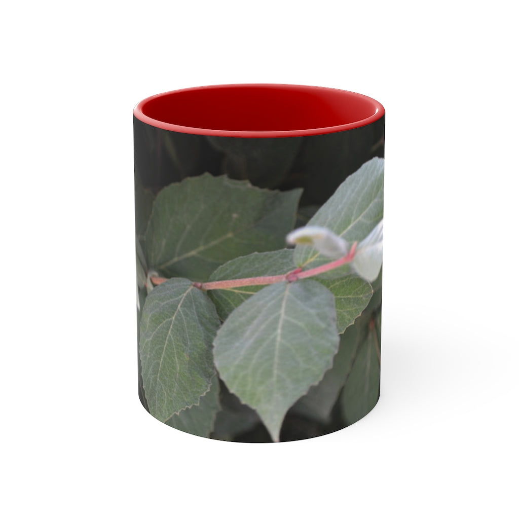 A stylish Green Leaves Accent Mug featuring a white exterior with a colored interior, showcasing a beautiful green leaves design.