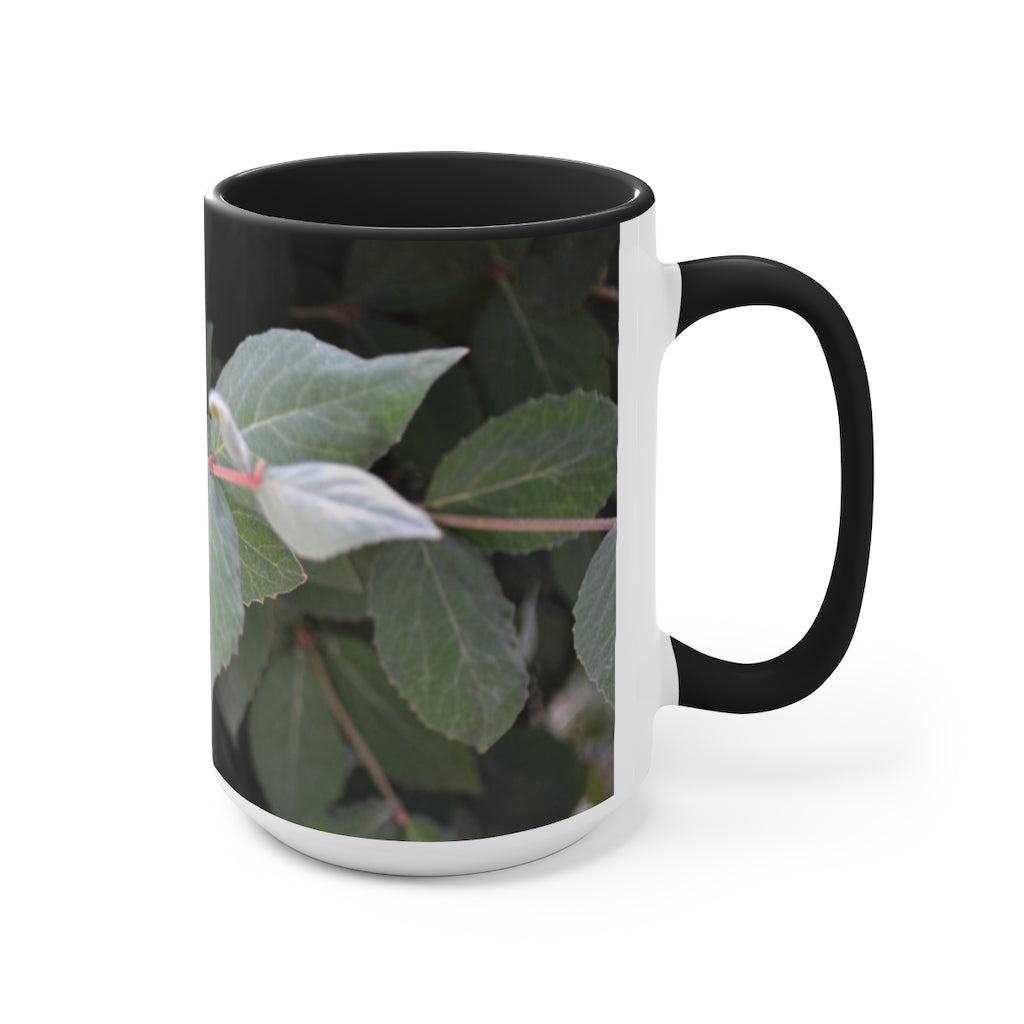 A stylish Green Leaves Accent Mug featuring a white exterior with a colored interior, showcasing a beautiful green leaves design.