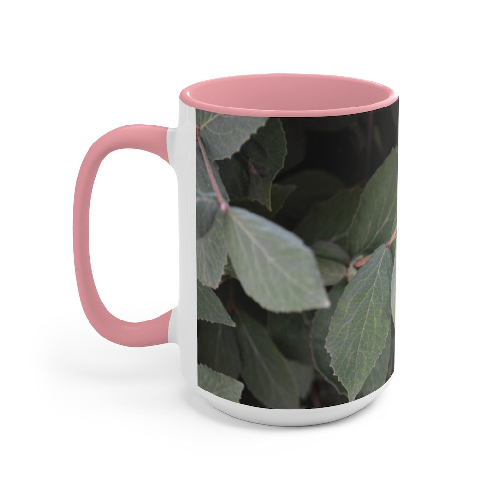 A stylish Green Leaves Accent Mug featuring a white exterior with a colored interior, showcasing a beautiful green leaves design.