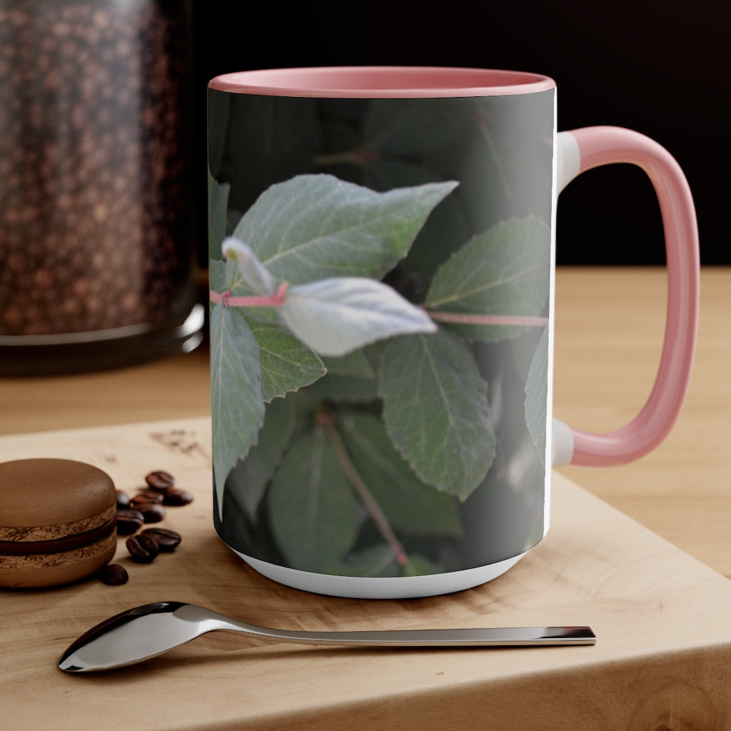 A stylish Green Leaves Accent Mug featuring a white exterior with a colored interior, showcasing a beautiful green leaves design.