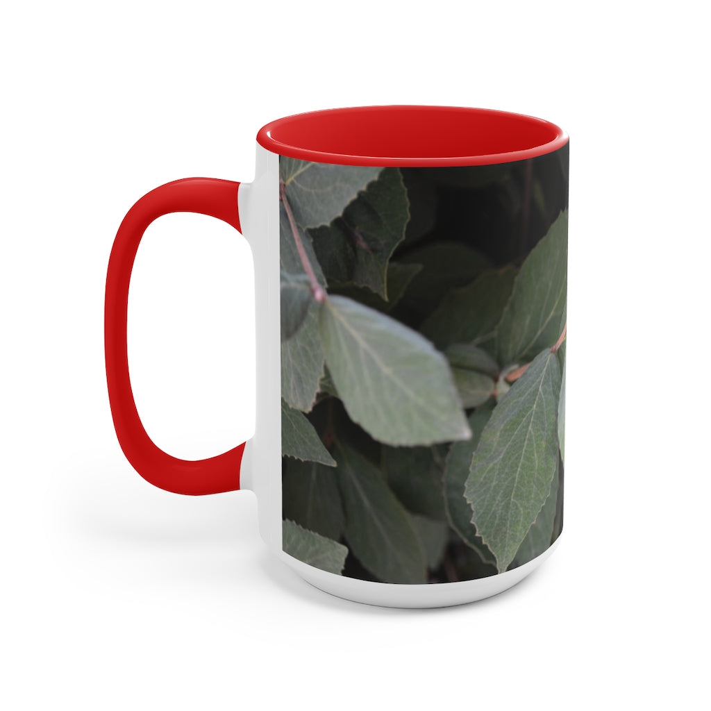 A stylish Green Leaves Accent Mug featuring a white exterior with a colored interior, showcasing a beautiful green leaves design.