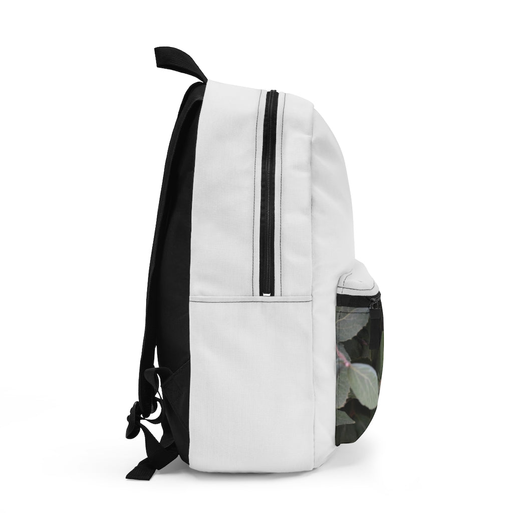 Green Leaves Backpack made from durable spun polyester, featuring adjustable straps and a custom name tag inside.