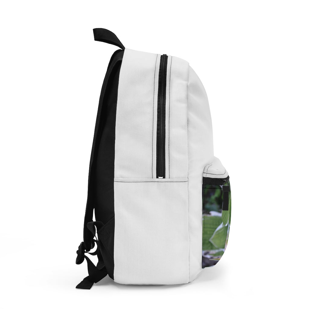 Green Leaves Backpack made from durable spun polyester, featuring adjustable straps and a custom name tag inside.