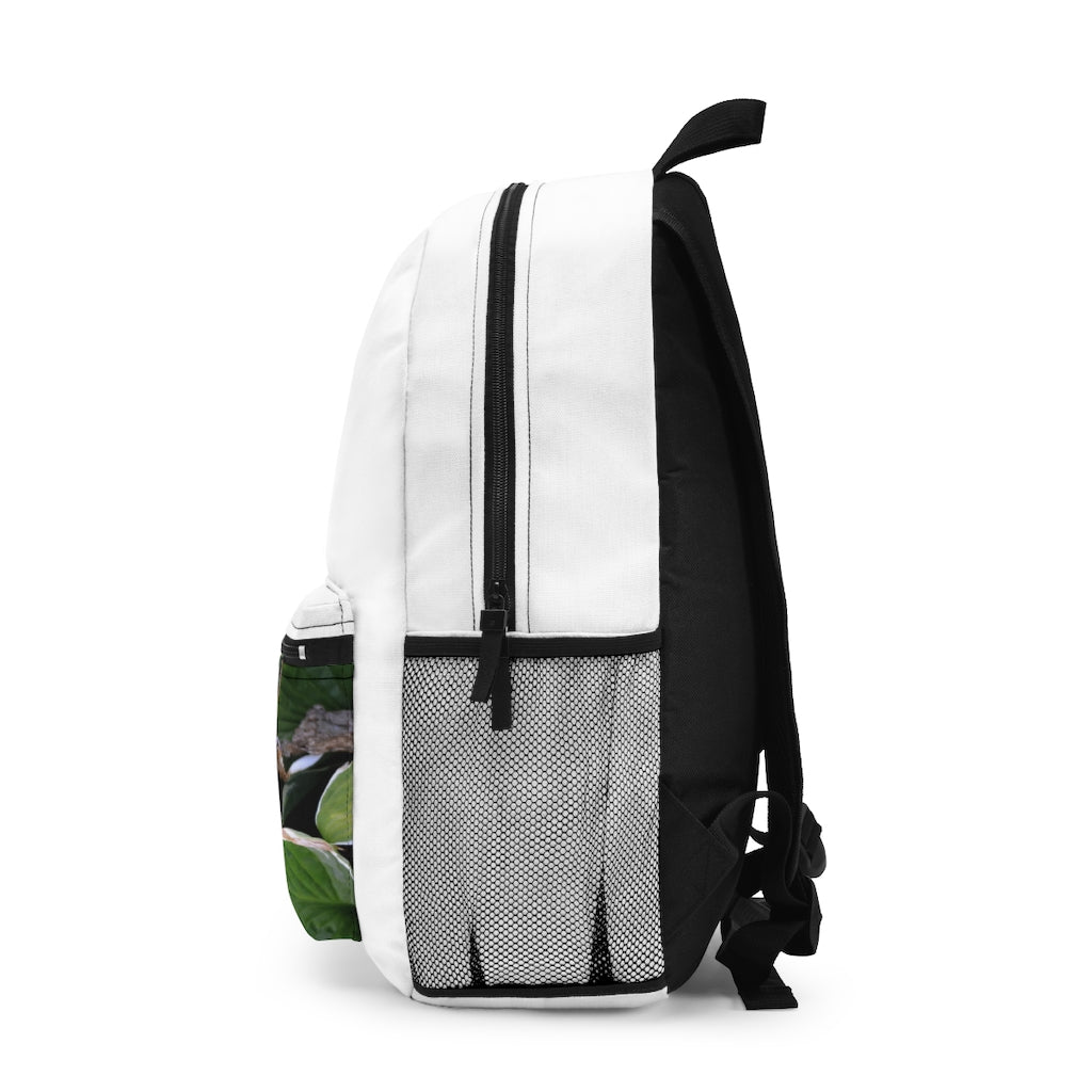 Green Leaves Backpack made from durable spun polyester, featuring adjustable straps and a custom name tag inside.