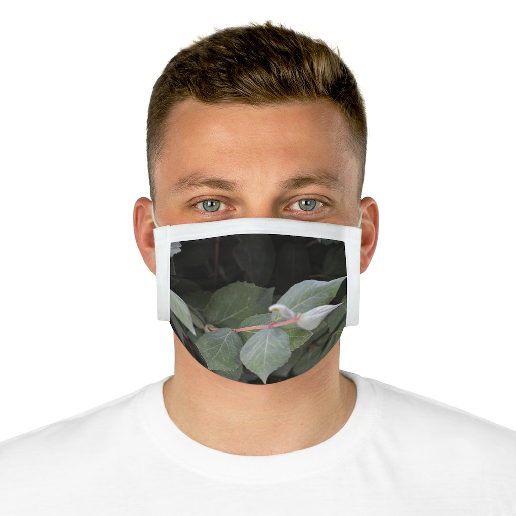 Green Leaves Cotton Face Mask featuring a stylish leaf pattern, made from 100% cotton with adjustable earloops and nose wire.