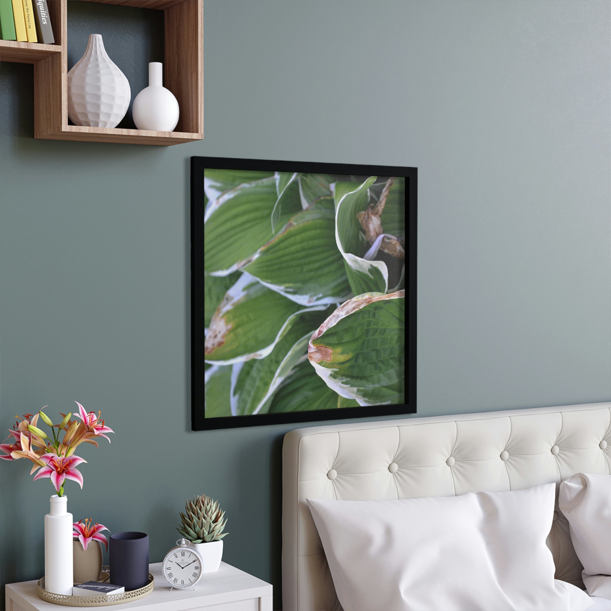 A beautifully framed poster featuring green leaves, showcasing a hand-crafted wooden frame and vibrant colors.