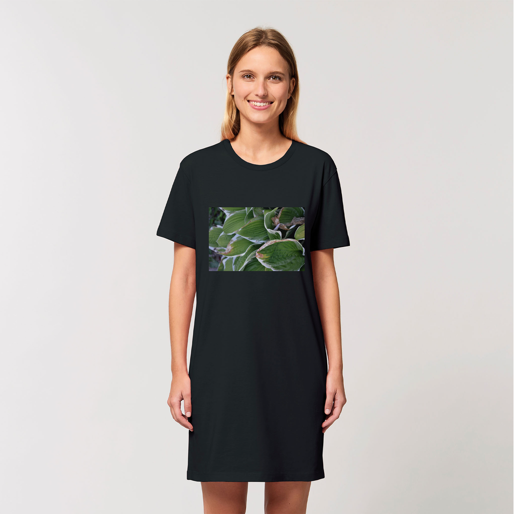 A stylish Green Leaves Organic T-Shirt Dress made from 100% organic cotton, showcasing its soft texture and casual design.