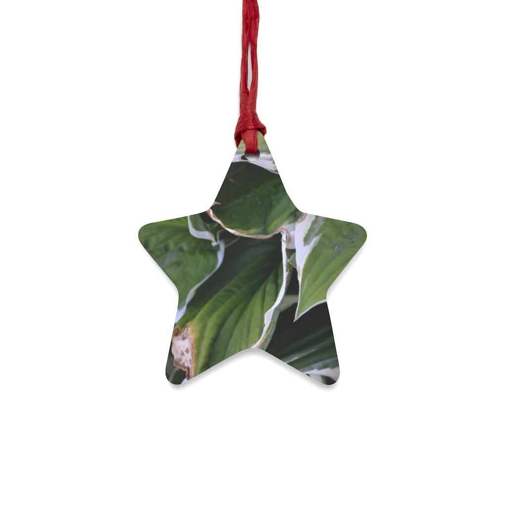 A collection of Green Leaves Wooden Christmas Ornaments in various whimsical shapes, featuring a rustic wooden finish and red hanging ribbons.