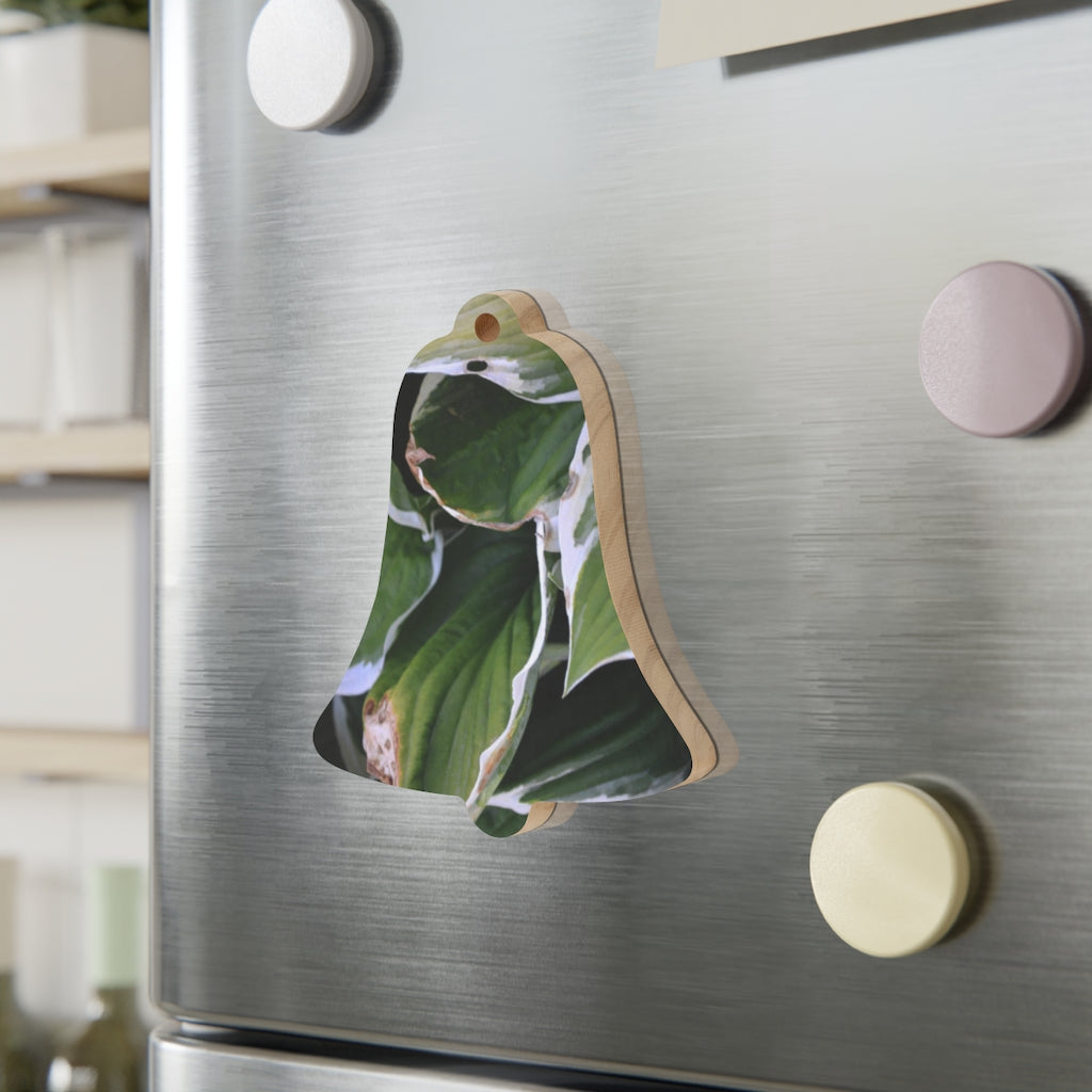 A collection of Green Leaves Wooden Christmas Ornaments in various whimsical shapes, featuring a rustic wooden finish and red hanging ribbons.