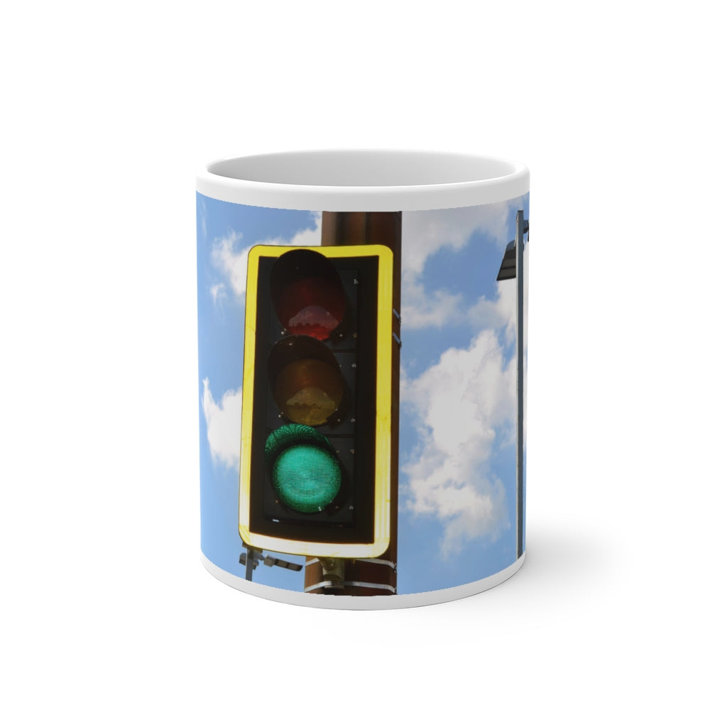 A green light color changing mug displaying vibrant colors when filled with hot liquid, showcasing its unique design and ceramic material.