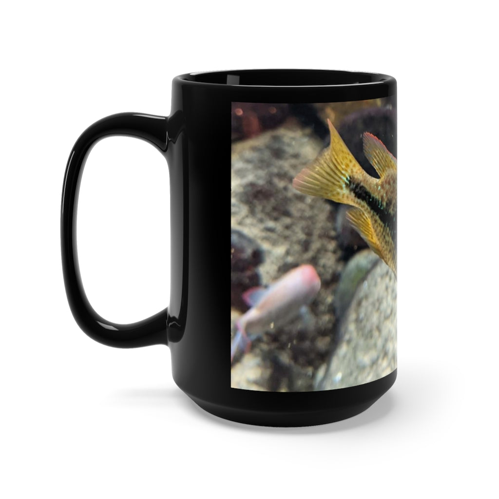 A stylish black ceramic mug featuring a grey and orange fish design, perfect for coffee and tea lovers, with a 15oz capacity.