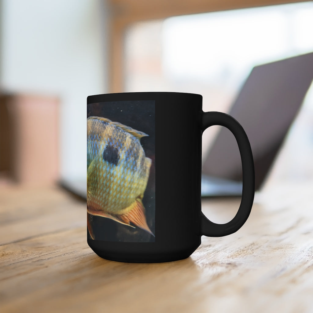 A stylish black ceramic mug featuring a grey and orange fish design, perfect for coffee and tea lovers, holding 15oz of your favorite beverage.