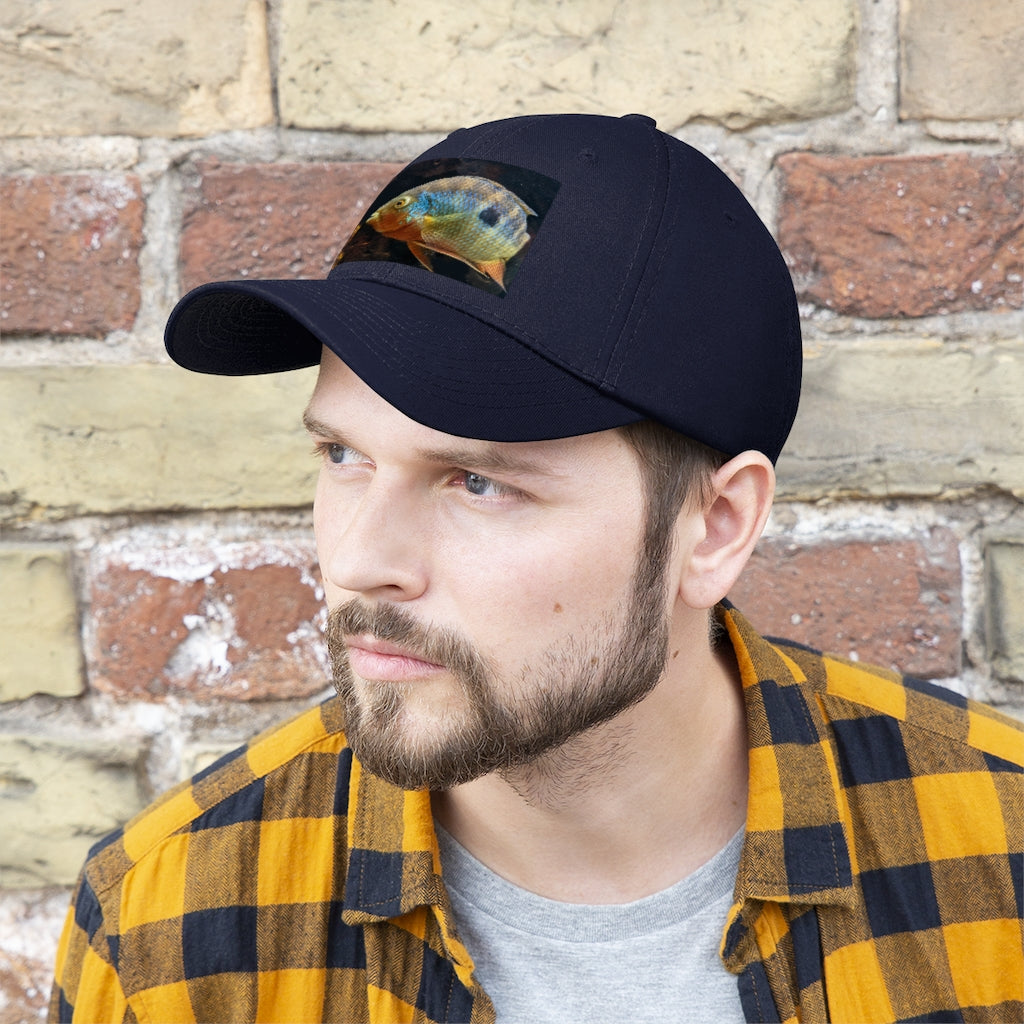 Grey and orange unisex twill hat with adjustable Velcro closure, perfect for outdoor activities and everyday wear.