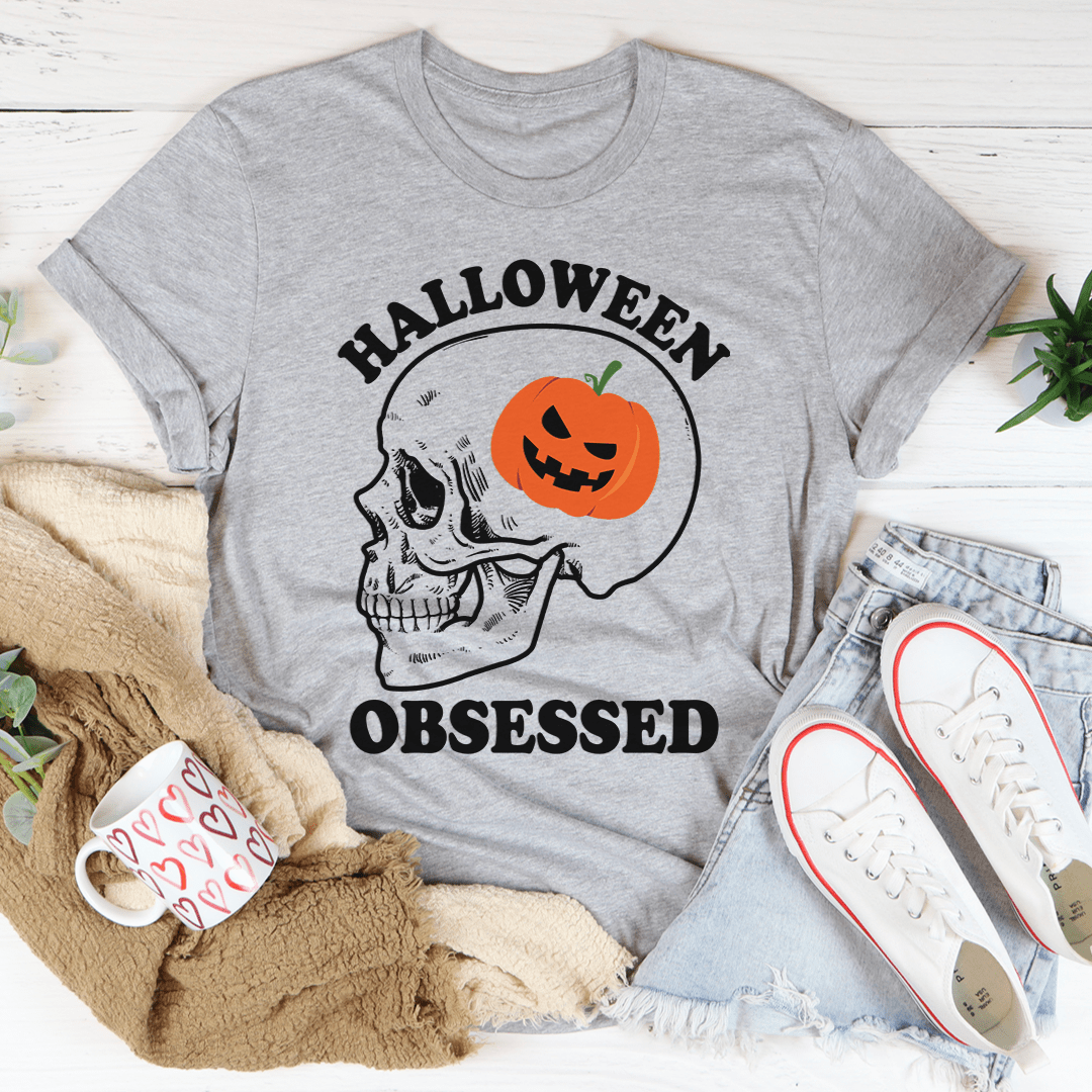 A black Halloween Obsessed T-Shirt featuring spooky graphics, made from soft ring-spun cotton with double stitching for durability.