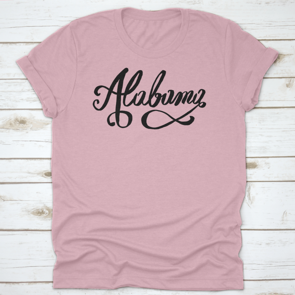 Hand-Lettering Calligraphy design of Alabama featuring an infinity sign, showcasing artistic typography on a soft fabric.