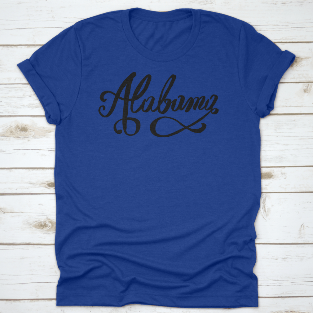 Hand-Lettering Calligraphy design of Alabama featuring an infinity sign, showcasing artistic typography on a soft fabric.