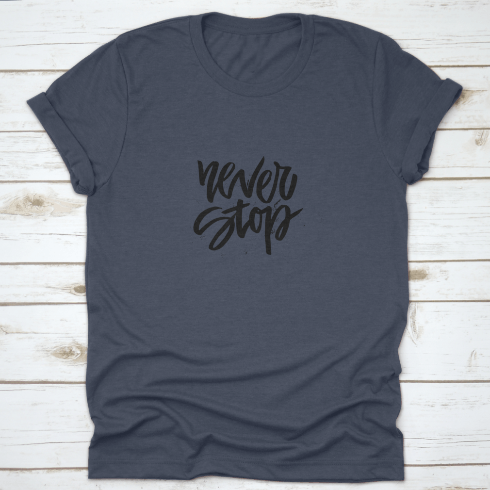 A stylish Handdrawn Lettering T-shirt featuring the motivational phrase 'Never Stop Inspiring' in a unique design.