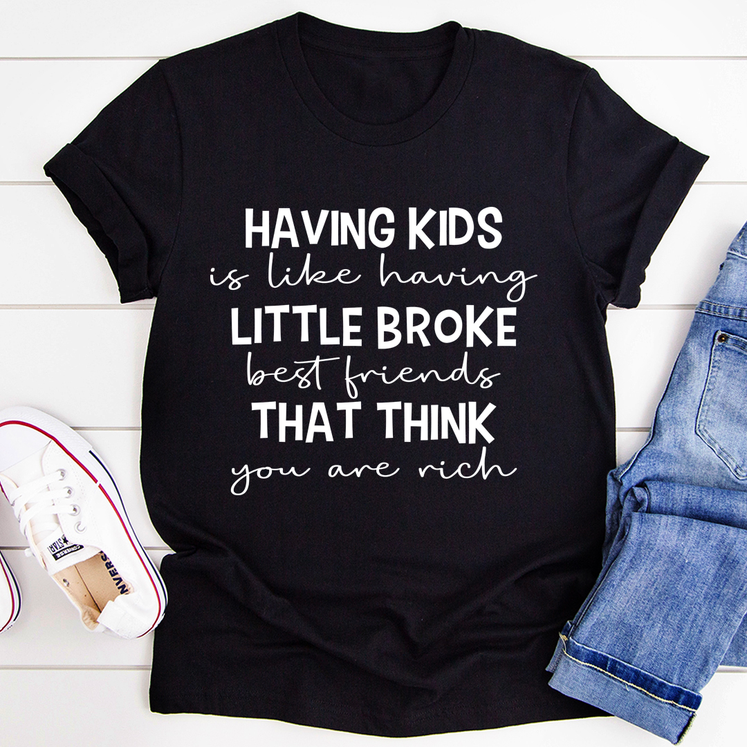 A humorous t-shirt featuring the phrase 'Having Kids Is Like Having Little Broke Friends', made from soft cotton with double stitching.