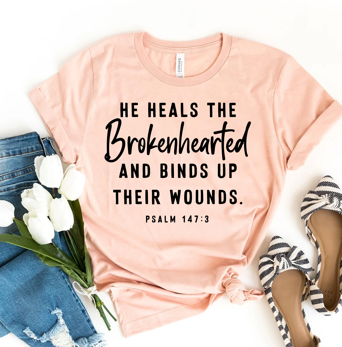 He Heals The Brokenhearted T-shirt made of premium ring spun cotton with a striking design and comfortable fit.