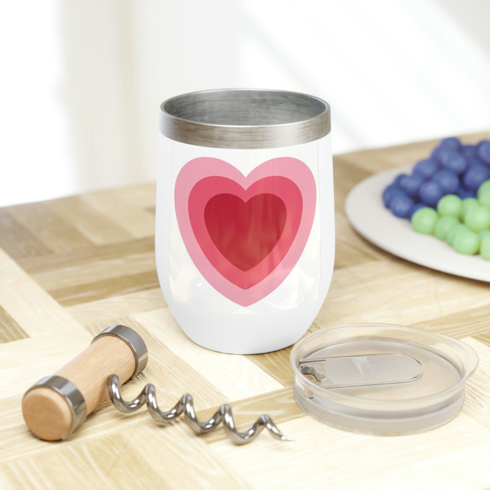 Hearts Chill Wine Tumbler in stainless steel with a customizable design, showcasing its double-insulated walls and stemless shape.