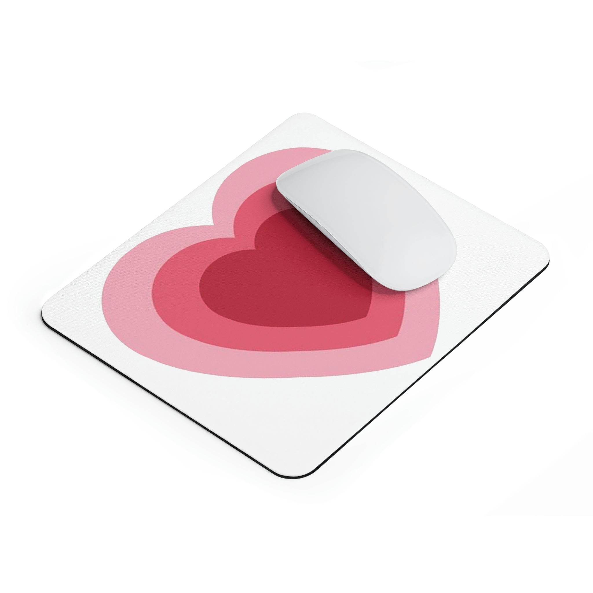 A stylish hearts design mouse pad with a non-slip rubber base, perfect for enhancing any workspace.