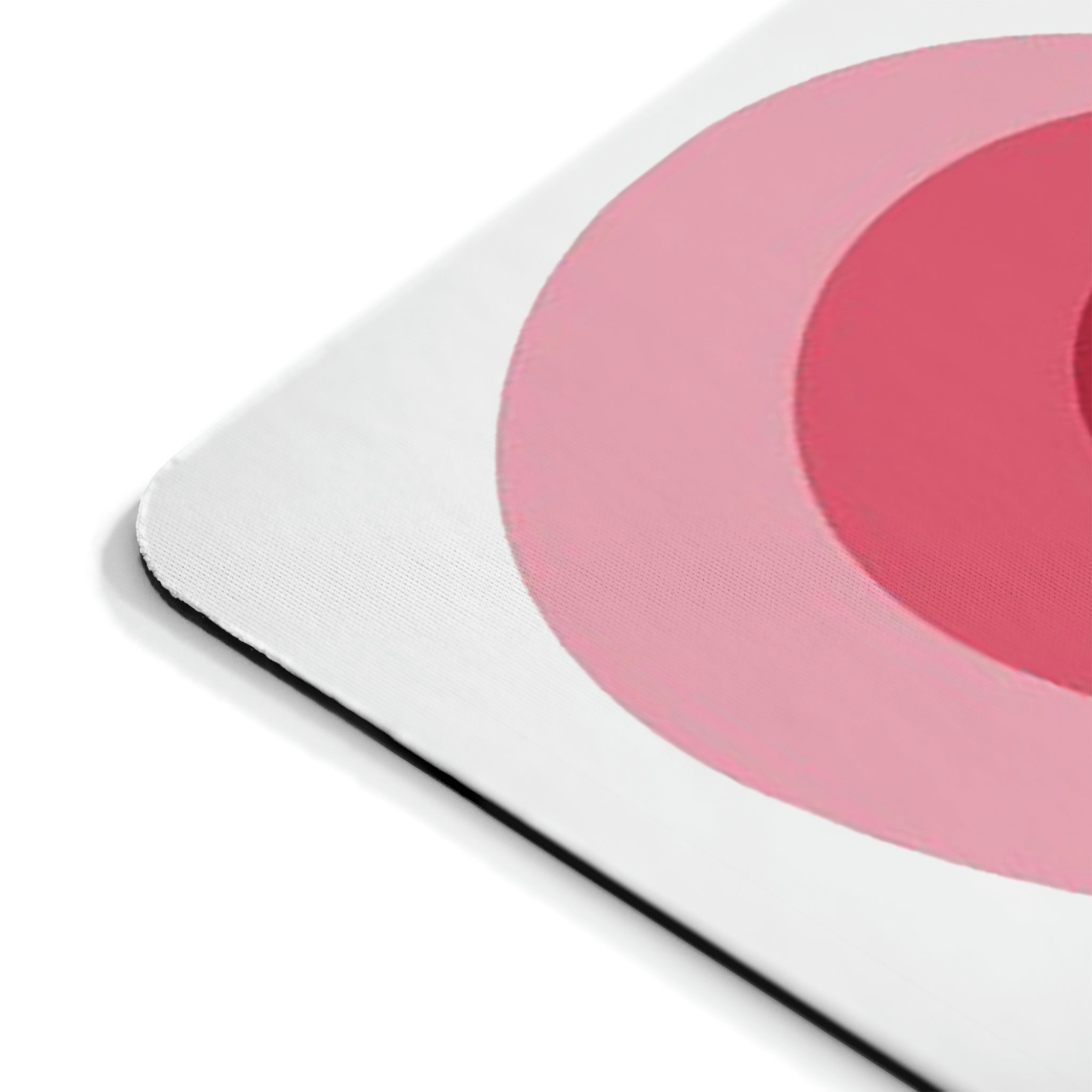 A stylish hearts design mouse pad with a non-slip rubber base, perfect for enhancing any workspace.