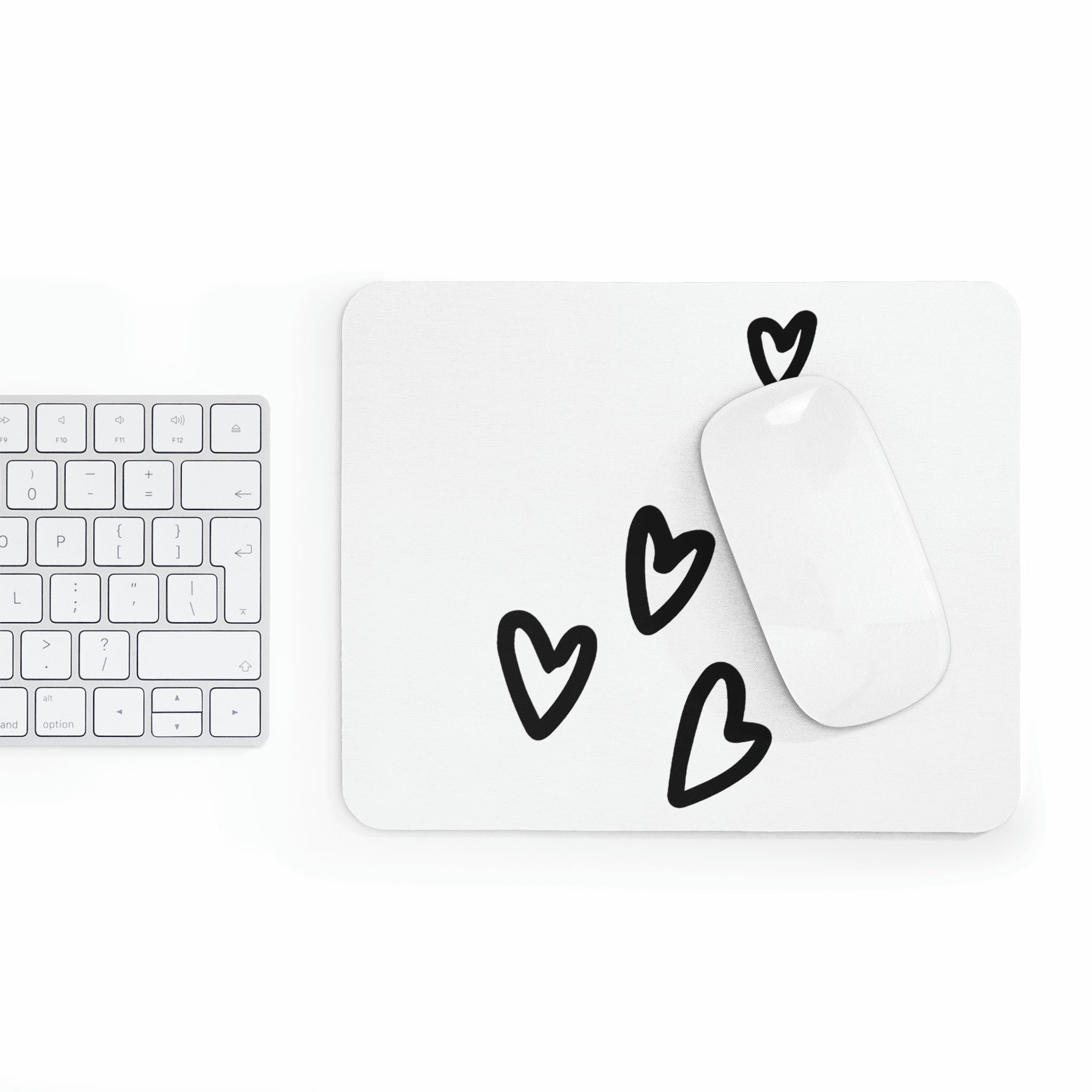 A stylish hearts-themed mouse pad designed for comfort and durability, featuring a non-slip base.