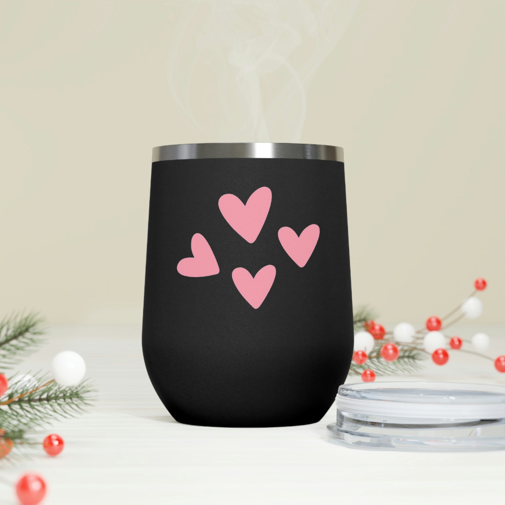 A stylish Hearts Wine Tumbler made of stainless steel with a clear plastic lid, perfect for hot and cold beverages.