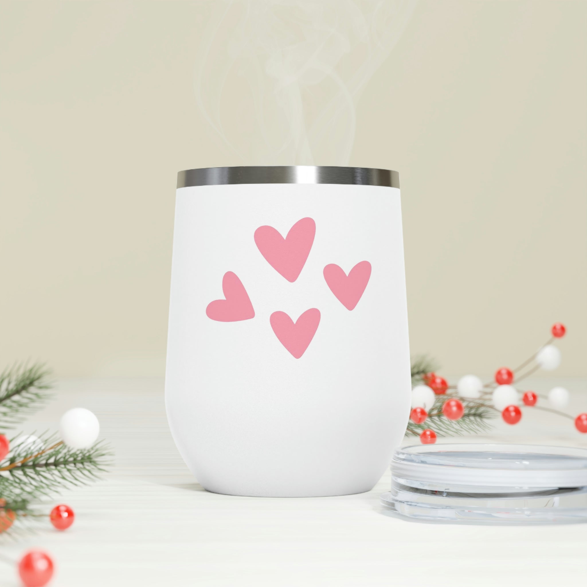 A stylish Hearts Wine Tumbler made of stainless steel with a clear plastic lid, perfect for hot and cold beverages.