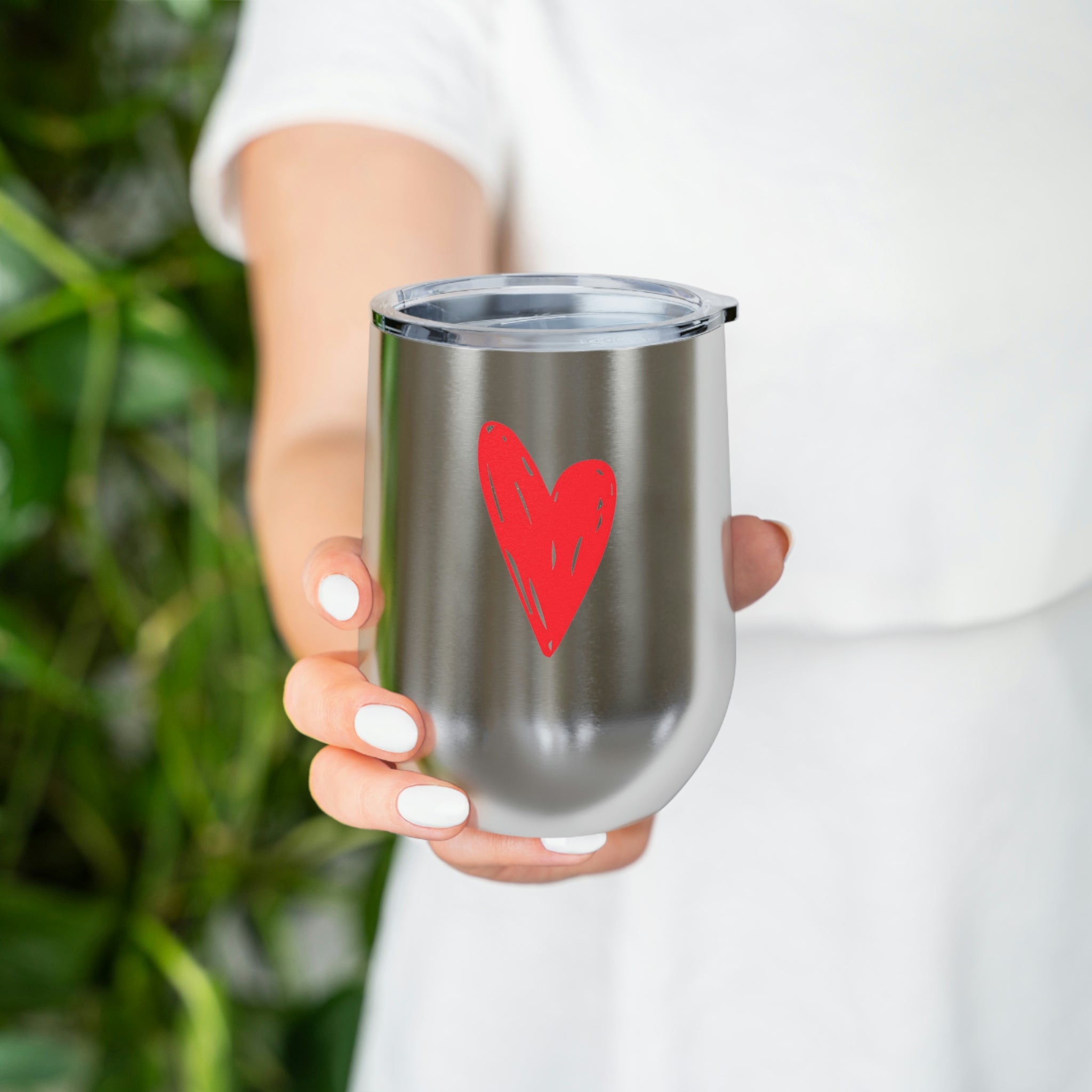 Hearts Wine Tumbler in stainless steel with a clear plastic lid, showcasing a stylish design for hot and cold beverages.