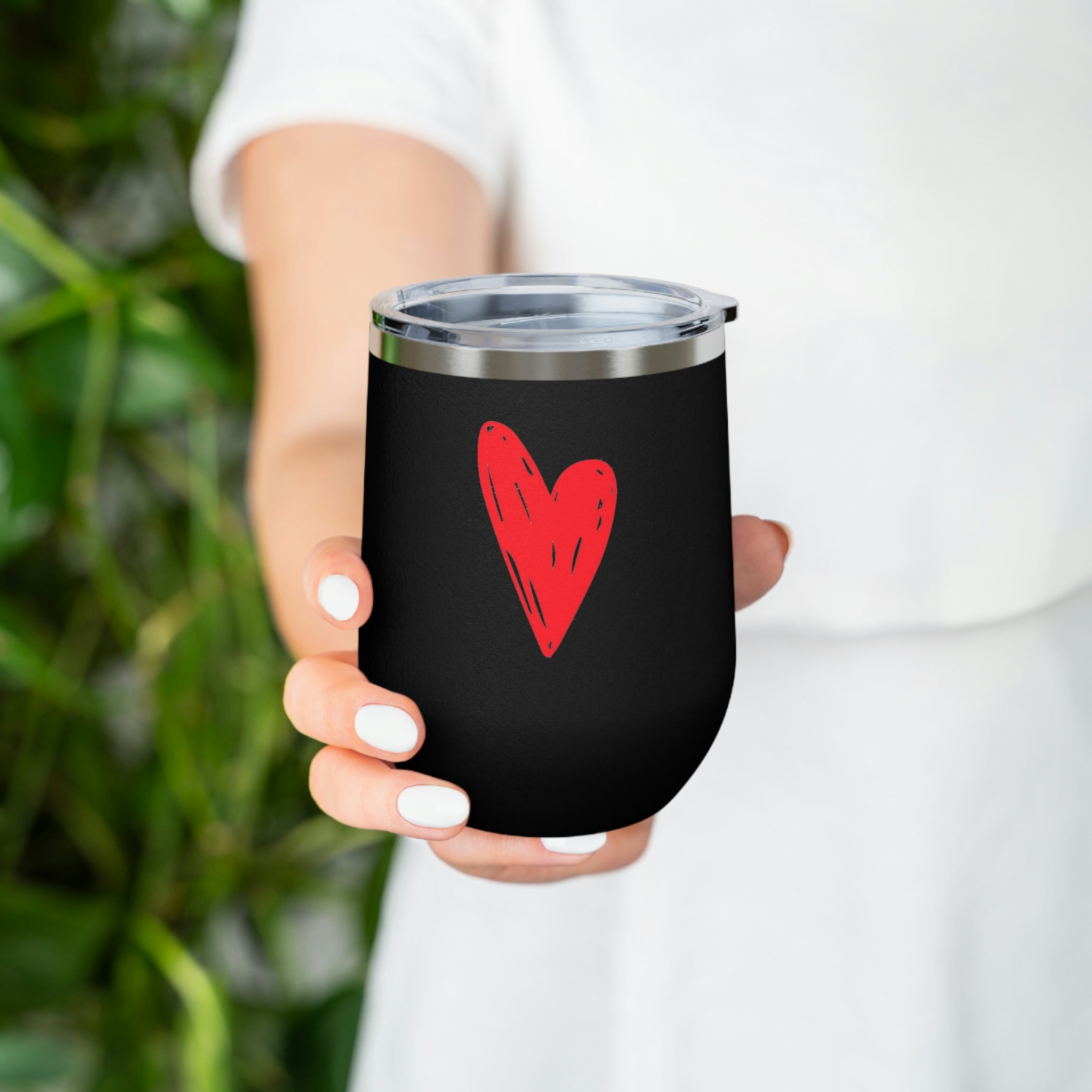 Hearts Wine Tumbler in stainless steel with a clear plastic lid, showcasing a stylish design for hot and cold beverages.