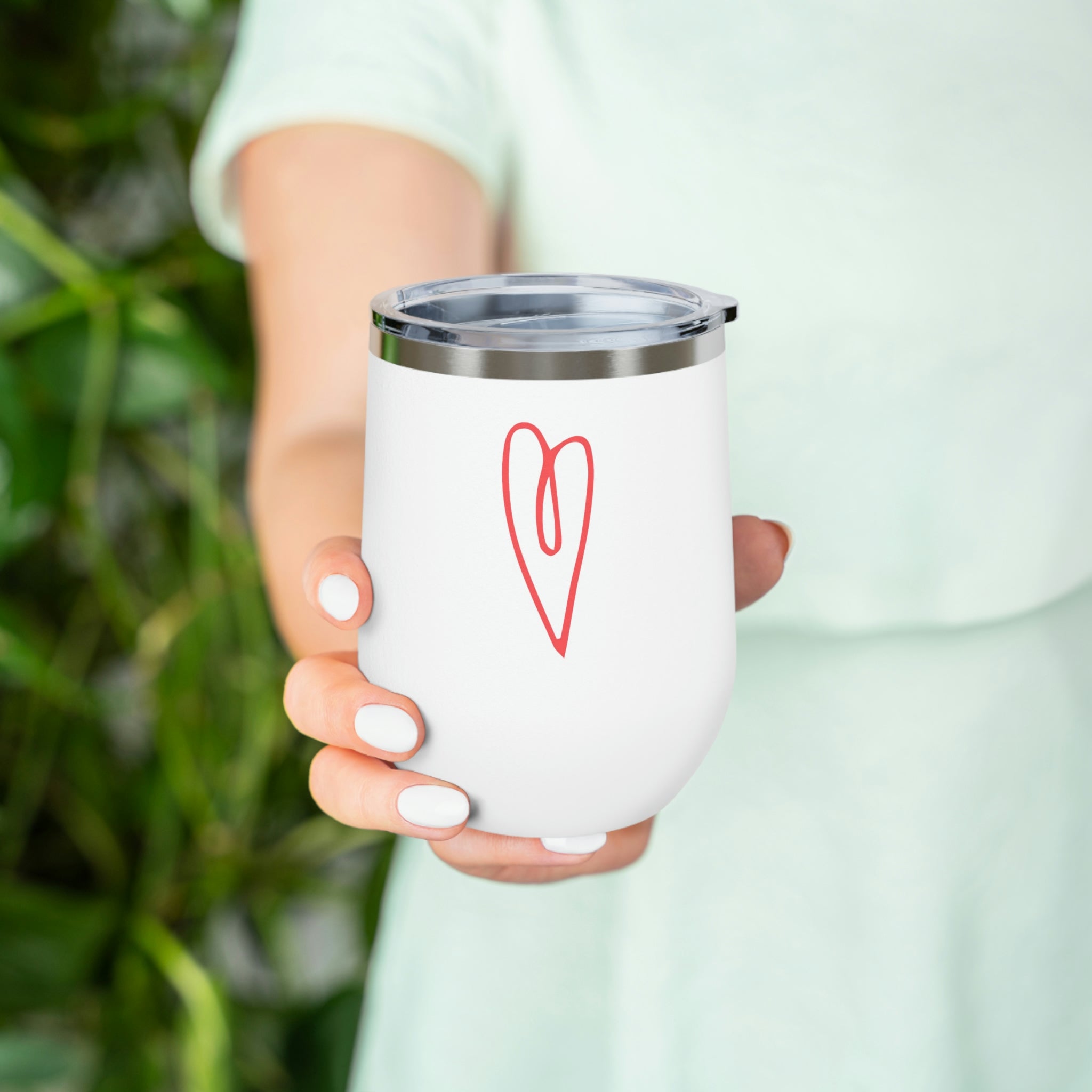 Hearts Wine Tumbler in stainless steel with a clear plastic lid, showcasing a stylish design for hot and cold beverages.