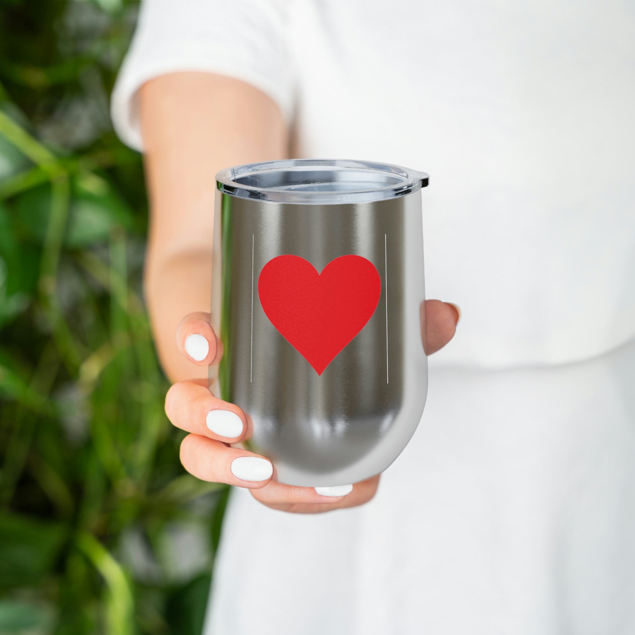 Hearts Wine Tumbler in stainless steel with a clear plastic lid, showcasing a stylish design perfect for hot and cold beverages.