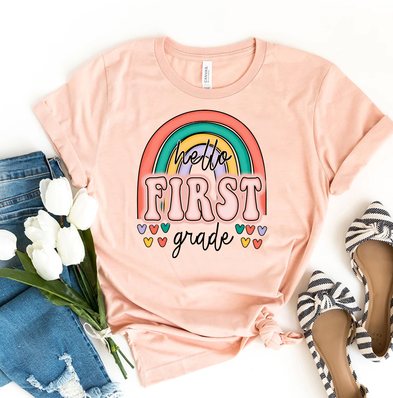 Hello First Grade T-shirt made of premium ring spun cotton, featuring a vibrant design suitable for young students.