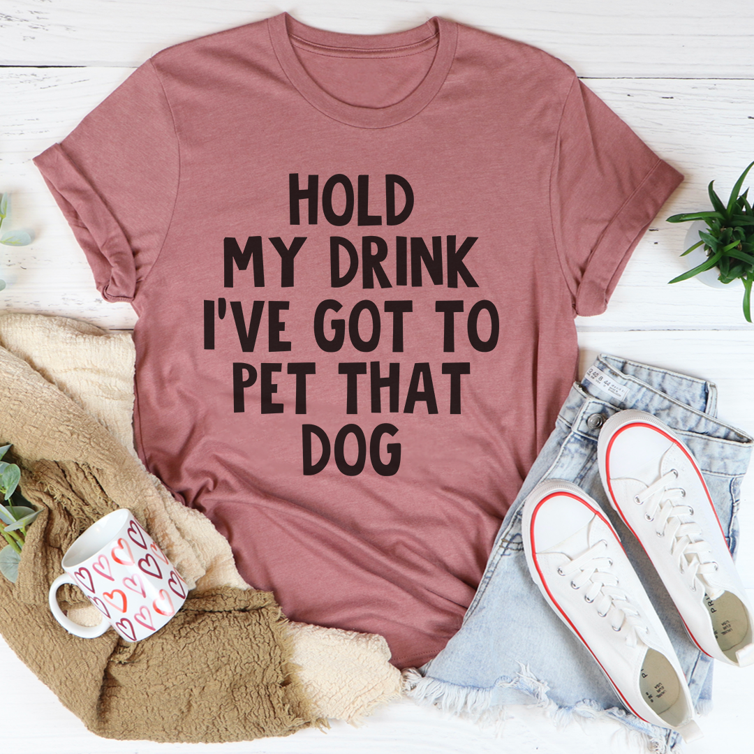 A comfortable Hold My Drink I've Got To Pet That Dog T-Shirt made from soft cotton, featuring a playful dog-themed graphic.