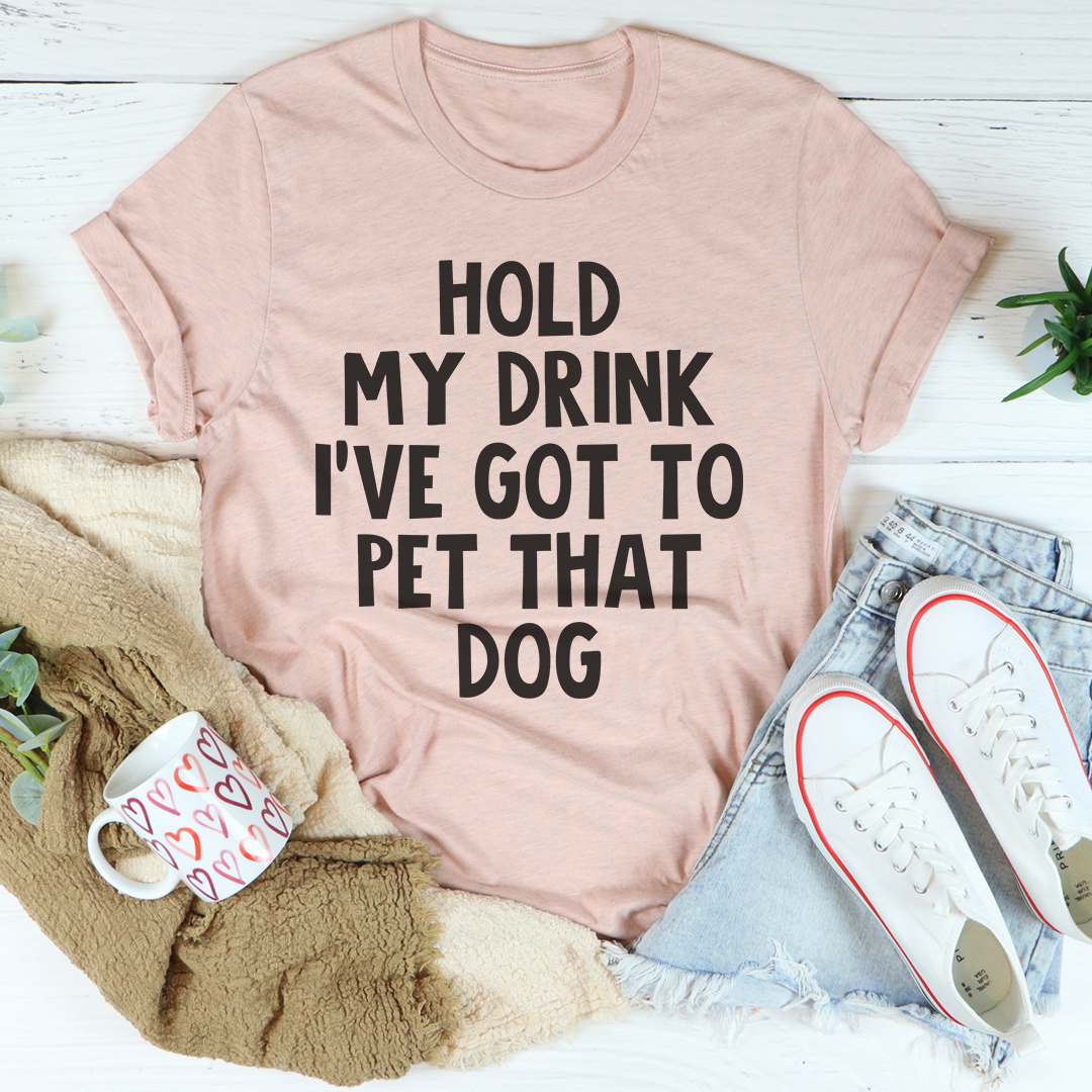 A comfortable Hold My Drink I've Got To Pet That Dog T-Shirt made from soft cotton, featuring a playful dog-themed graphic.