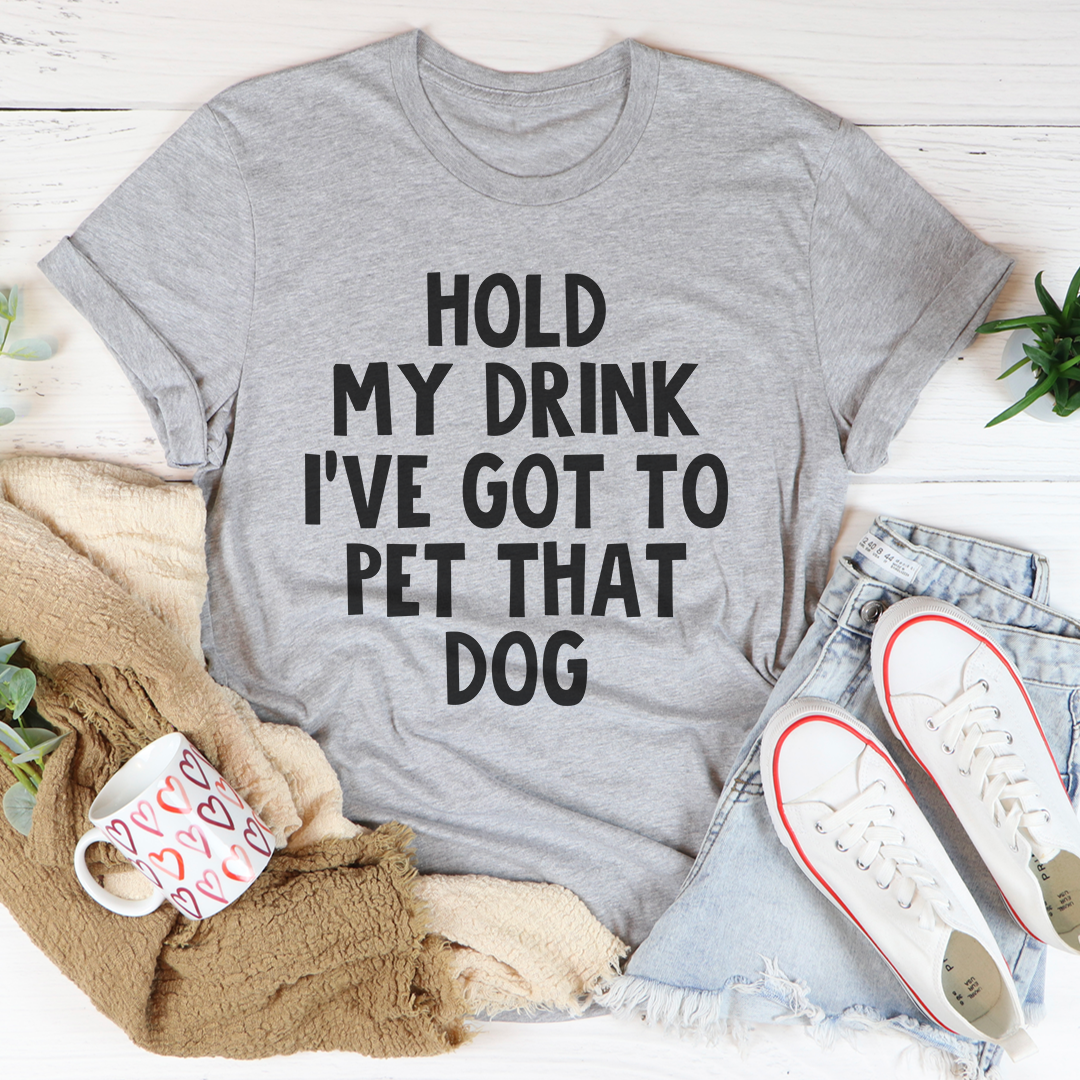 A comfortable Hold My Drink I've Got To Pet That Dog T-Shirt made from soft cotton, featuring a playful dog-themed graphic.