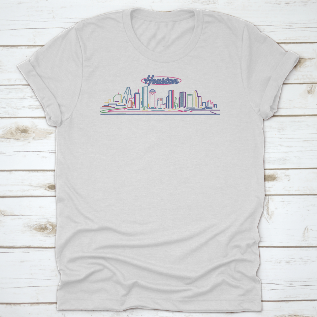 A vibrant t-shirt featuring the illuminated Houston skyline at night, showcasing the cityscape against a blue hour backdrop.