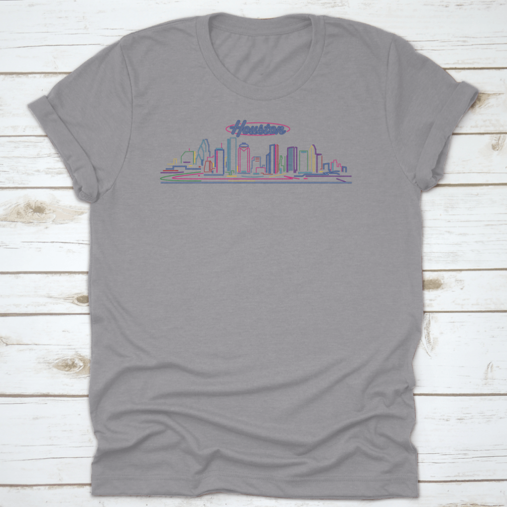 A vibrant t-shirt featuring the illuminated Houston skyline at night, showcasing the cityscape against a blue hour backdrop.