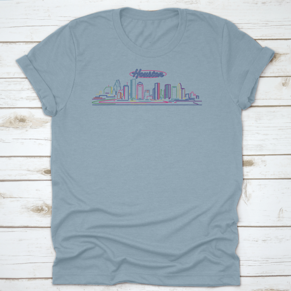 A vibrant t-shirt featuring the illuminated Houston skyline at night, showcasing the cityscape against a blue hour backdrop.