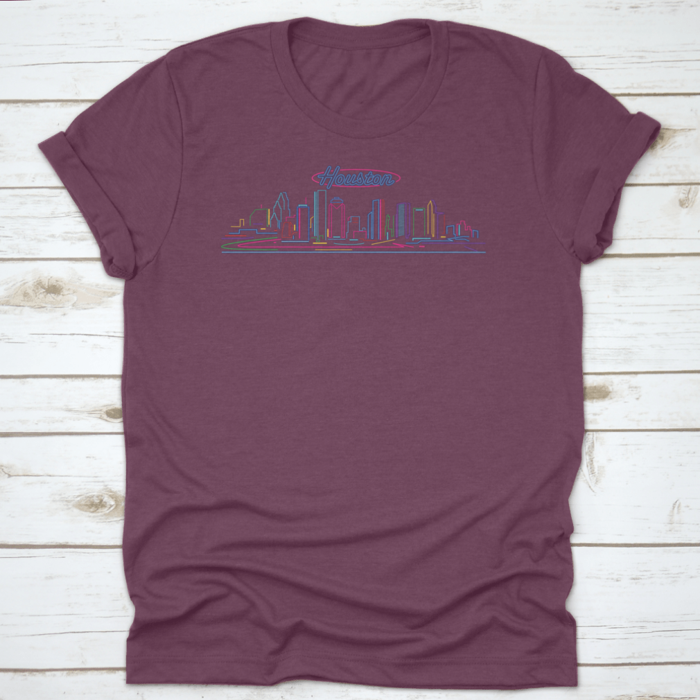 A vibrant t-shirt featuring the illuminated Houston skyline at night, showcasing the cityscape against a blue hour backdrop.